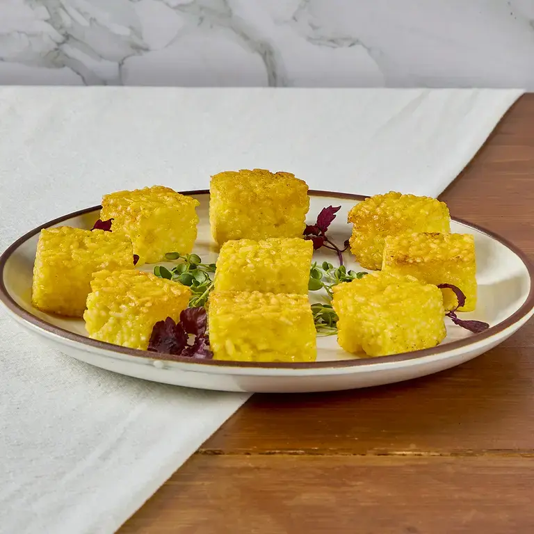 Mini risotti al salto con fonduta di grana